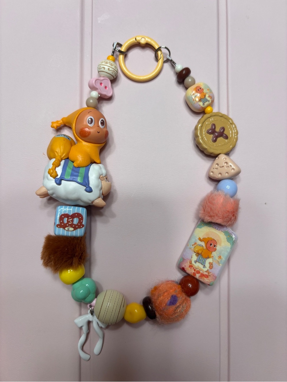Playful Orange Character Stroller Chain with Multicolor Beads